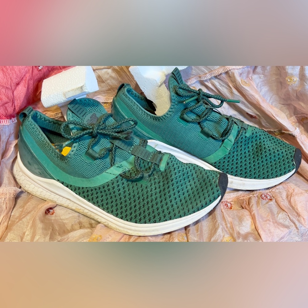 New Balance women’s 9.5 or men’s 8 sneakers